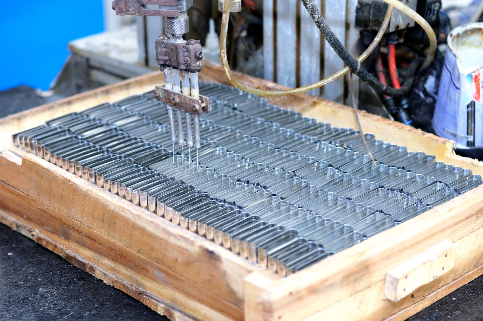 Metal components moving through a controlled production process