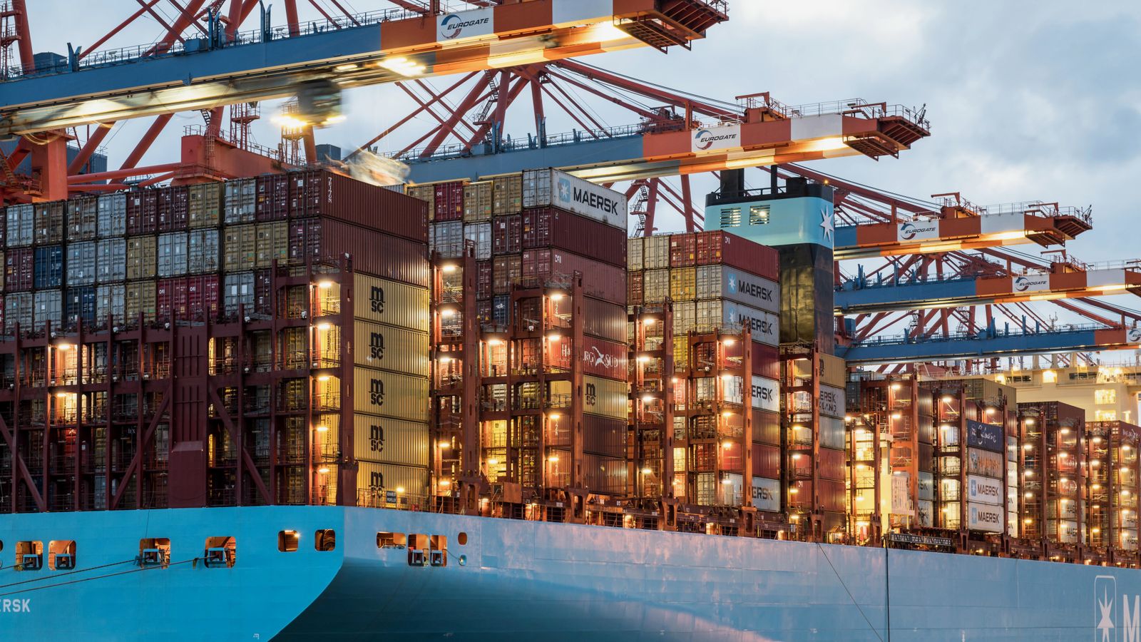 Container vessel being handled at an industrial port