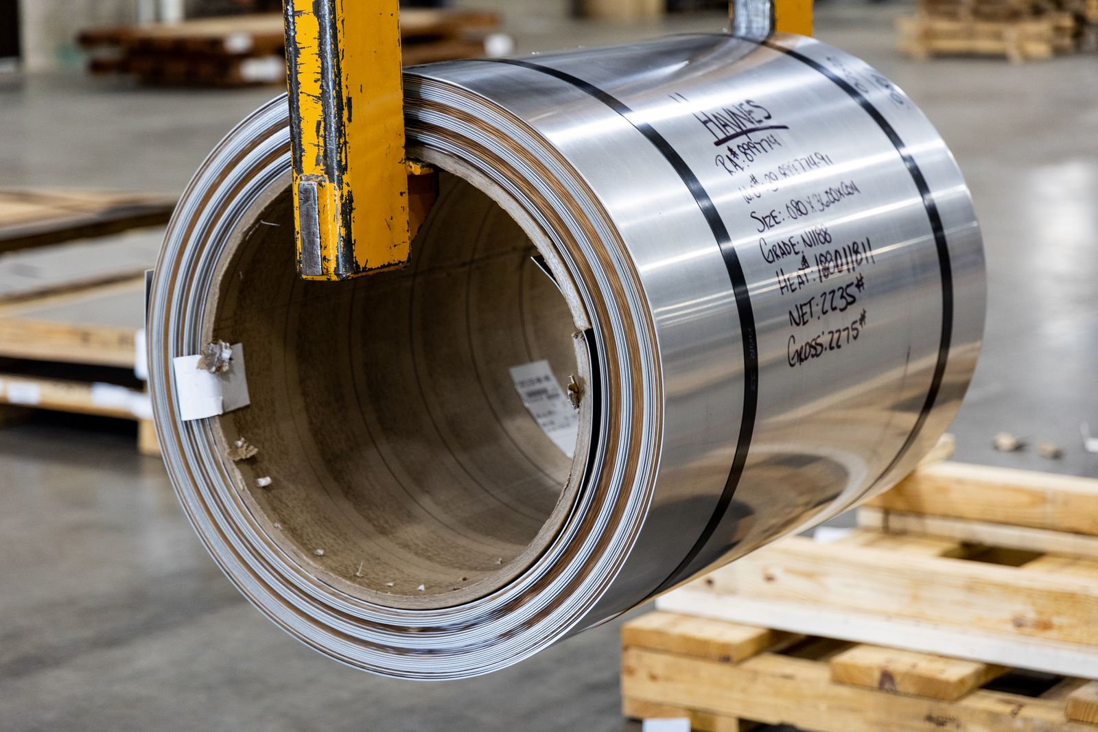 Marked steel coil prepared for regulated industrial supply