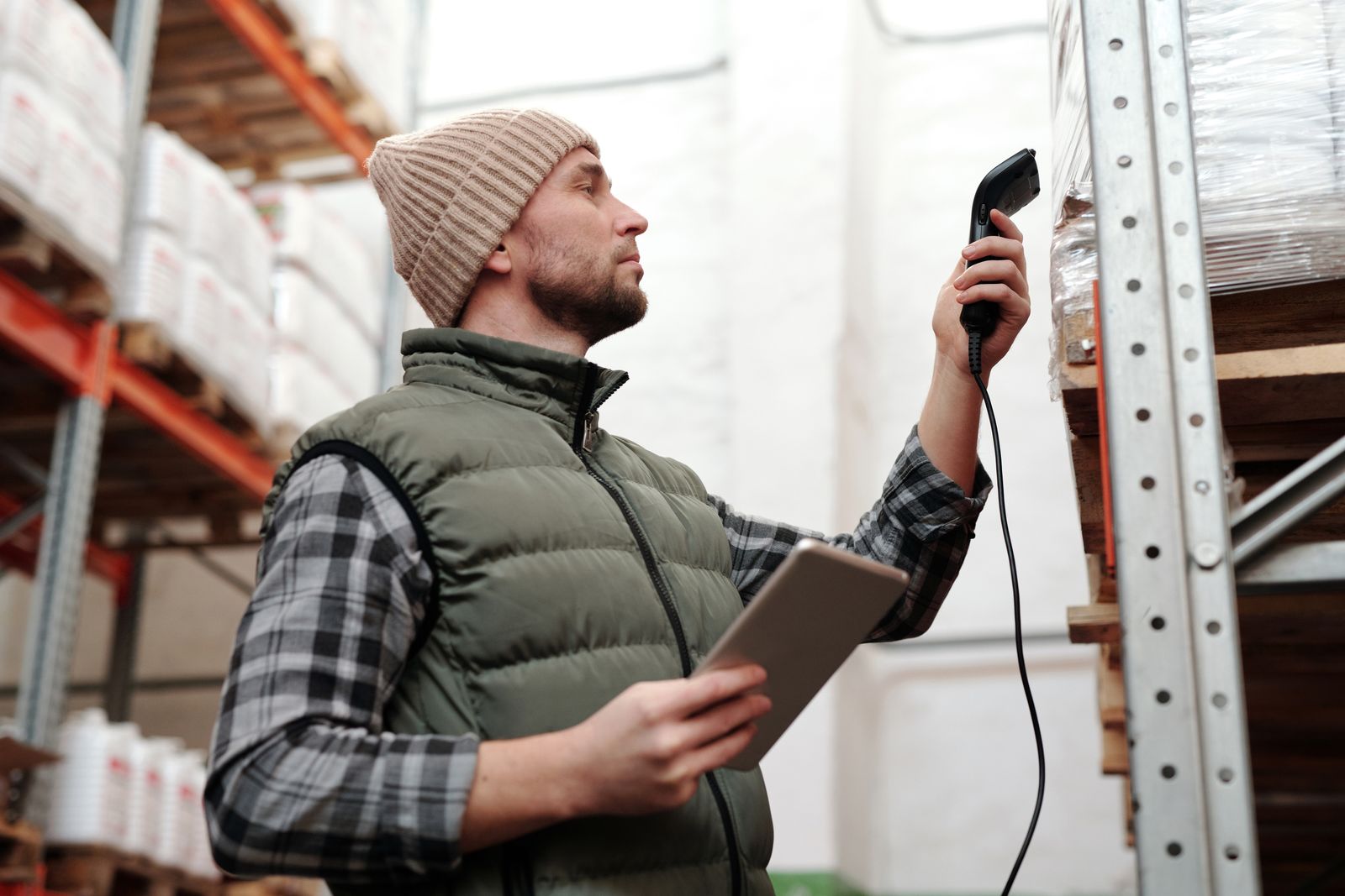 Warehouse worker scanning an item for digital identification